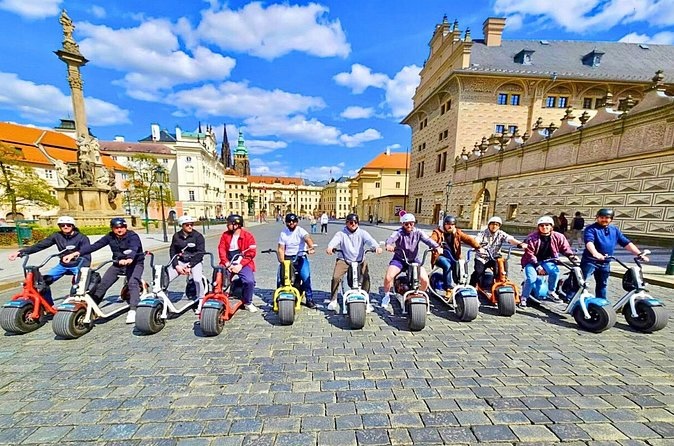 Riders on SCROOSER fat-tire scooters in Prague